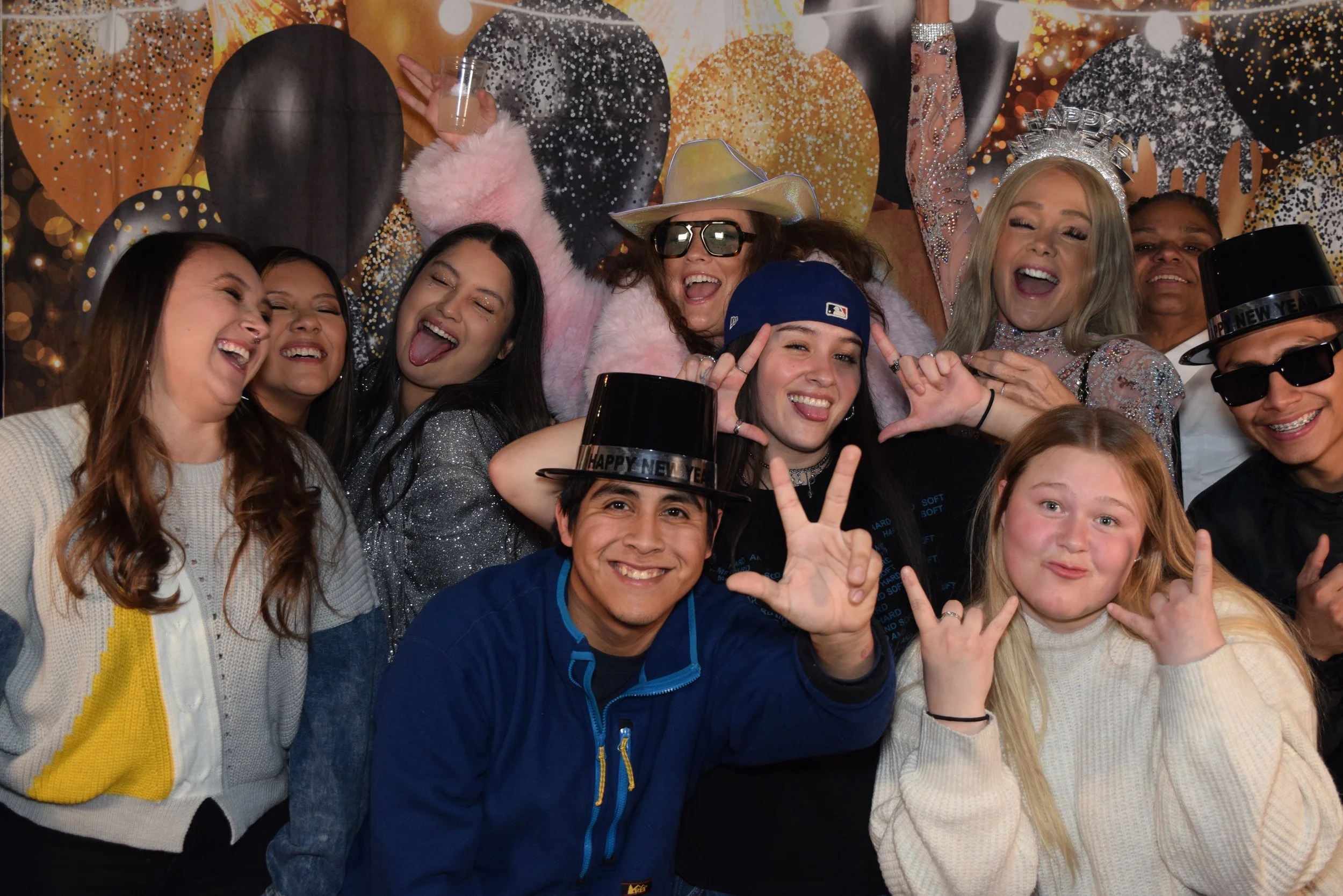 People in front of a photobooth backdrop.