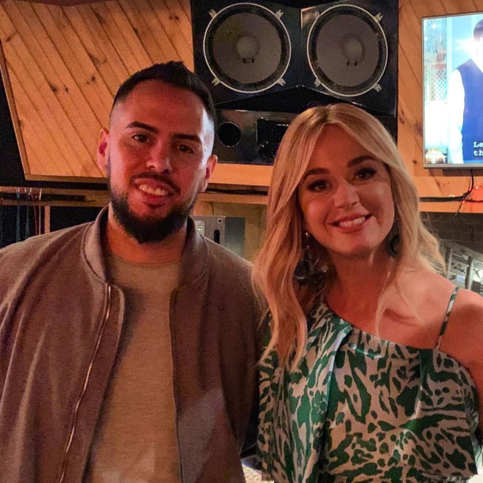 Audio engineer celebrating a finished mix with Katy Perry – platinum-selling production team