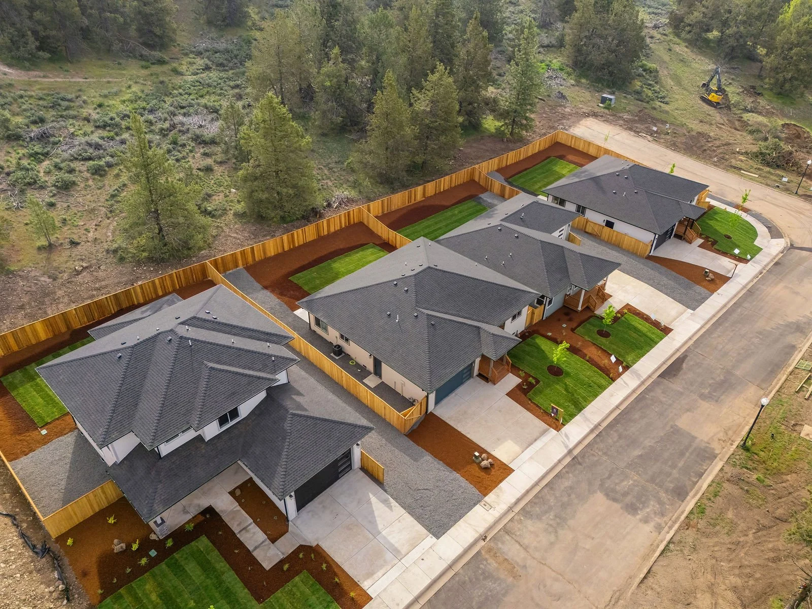 Professional real estate photography and drone imagery- Exterior of multi-homes for sale in new neighborhood development. 