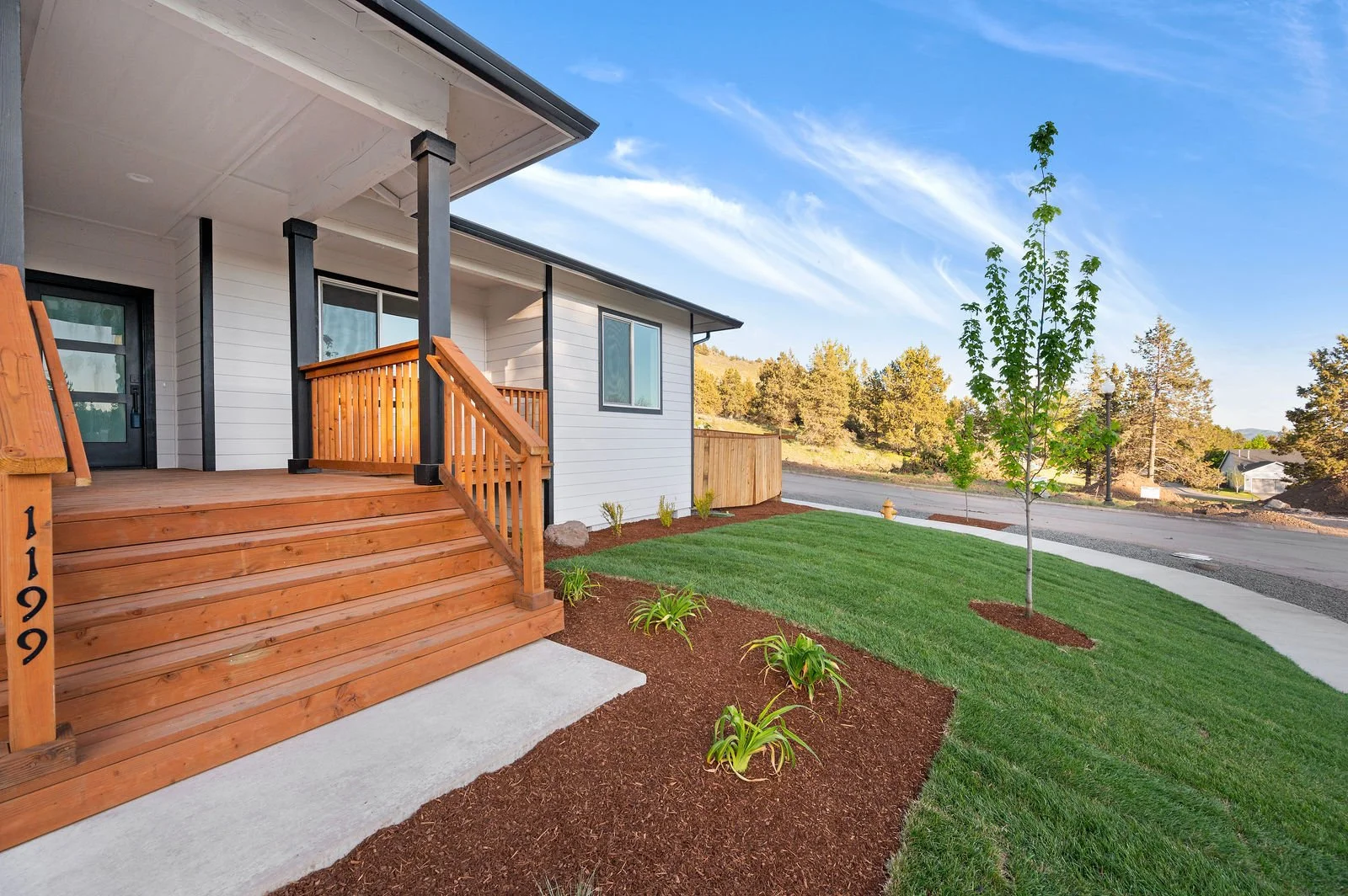 Professional real estate photography and drone imagery- Exterior of home porch view. 