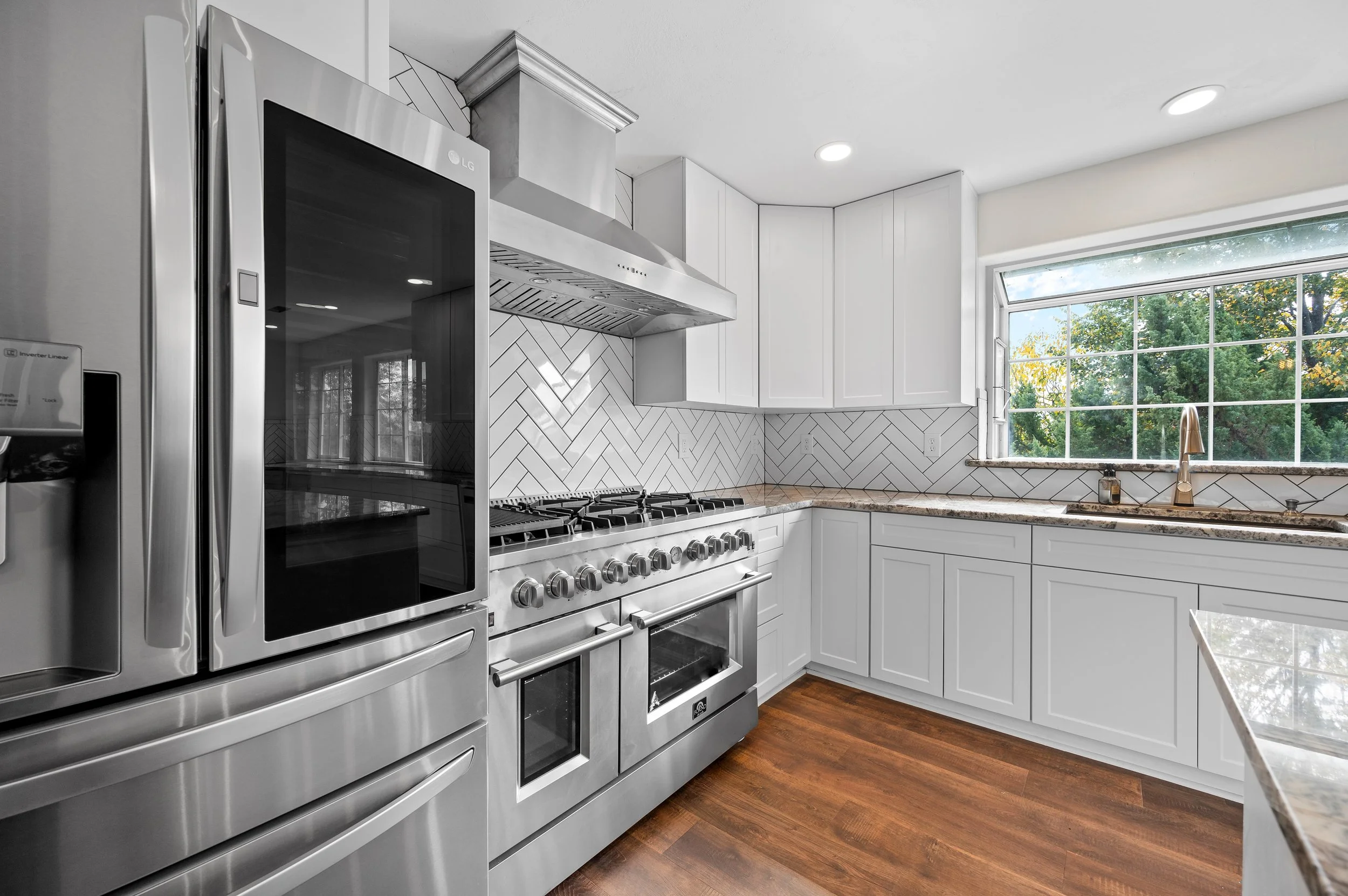 Up close high end real estate photograph of kitchen appliances in newly remodeled kitchen
