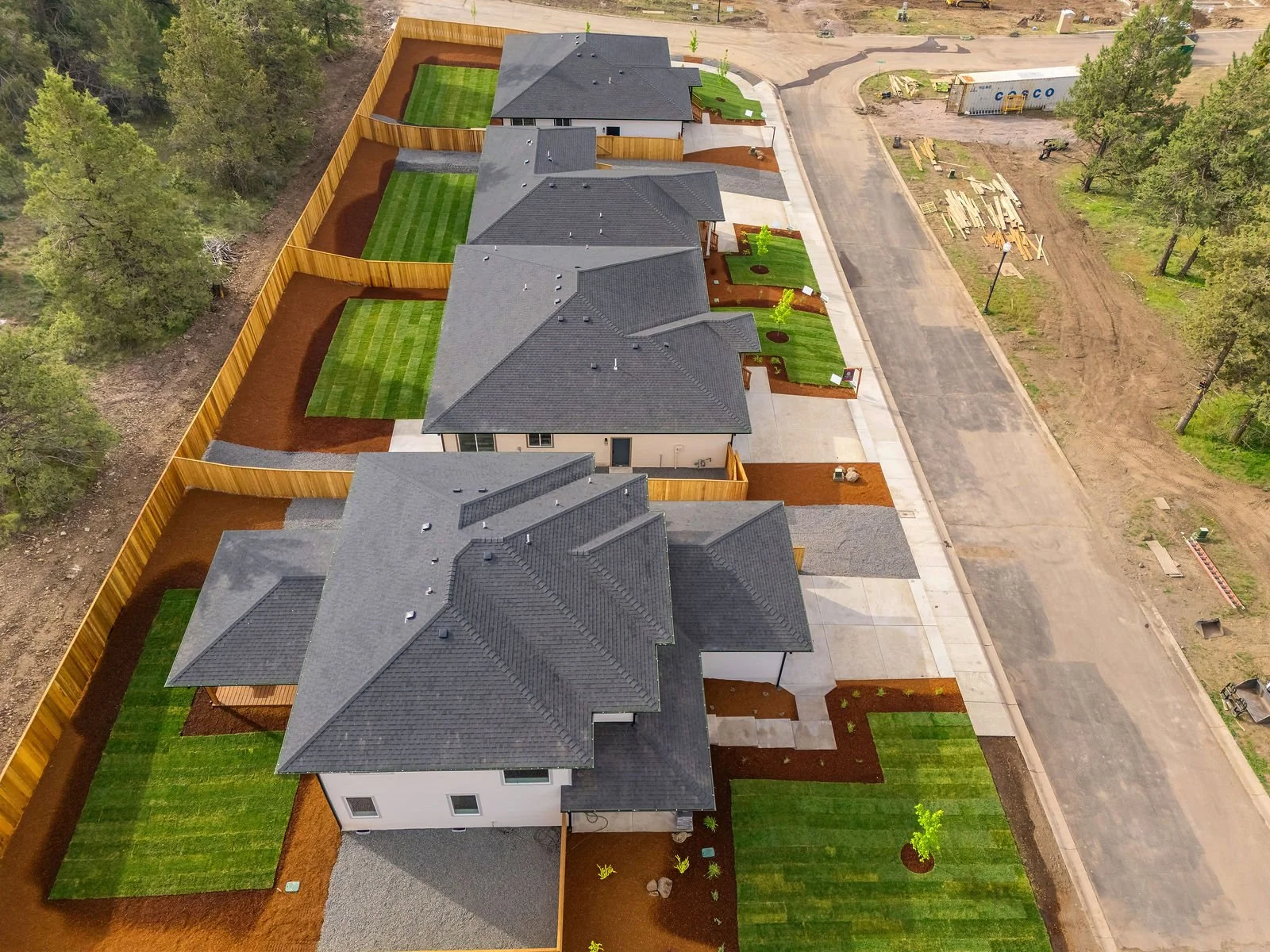 Professional real estate photography and drone imagery-Exterior of four homes with drone imagery for new development. 