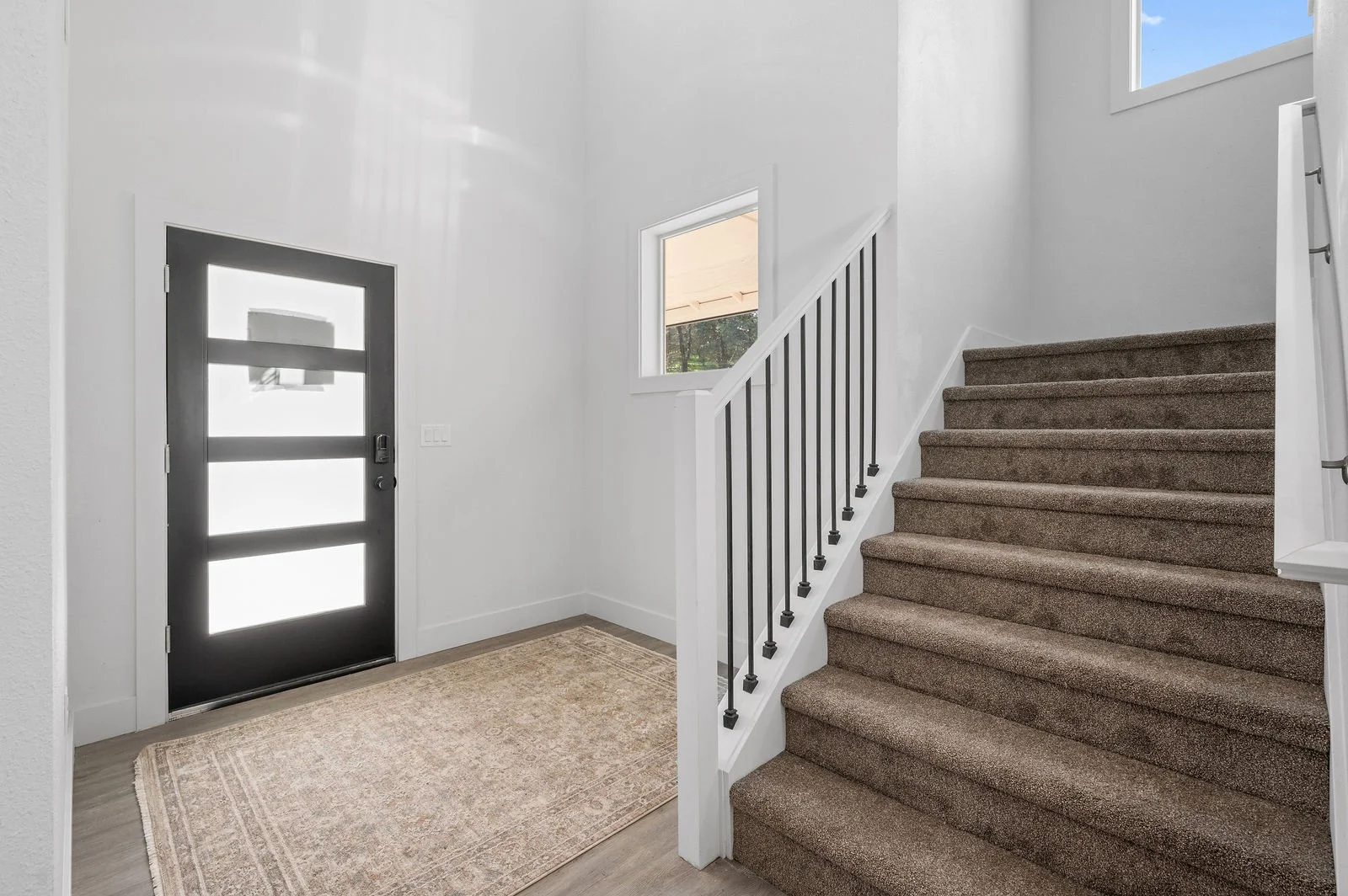 Professional real estate photography and drone imagery-Entry space with stairway. 