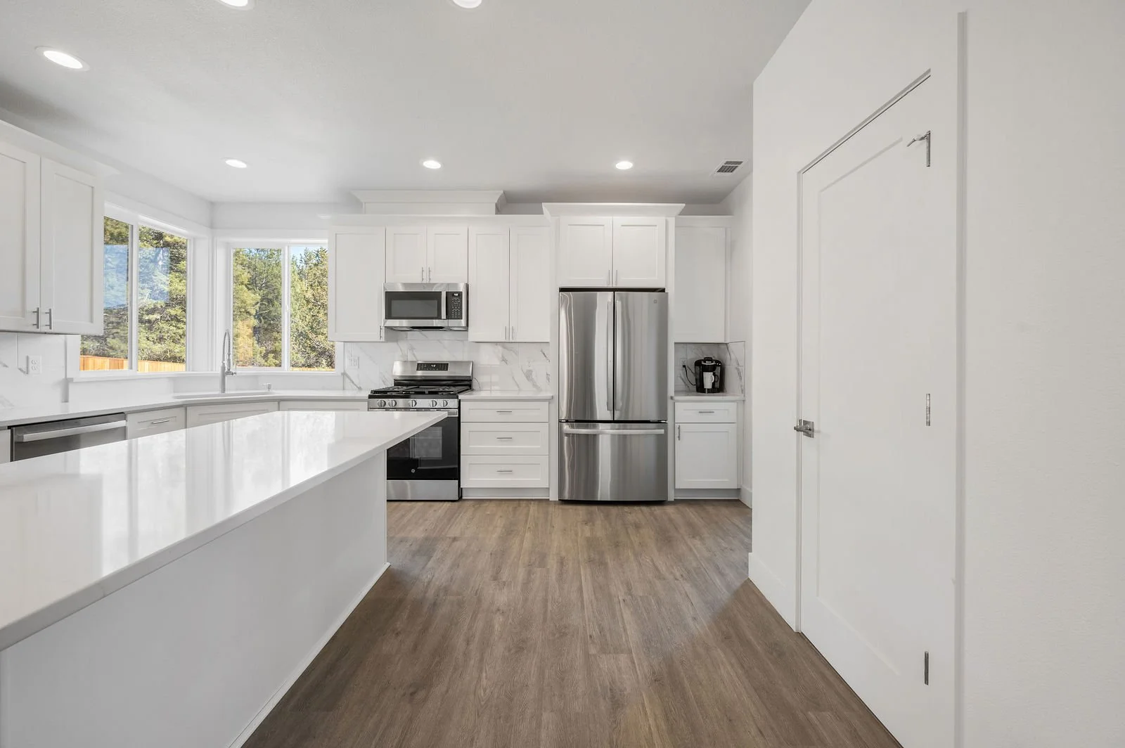 Professional real estate photography and drone imagery- Interior straight on shot of kitchen space. 