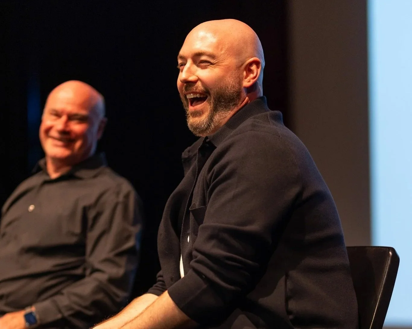 Paul Flavel having a giggle on stage.