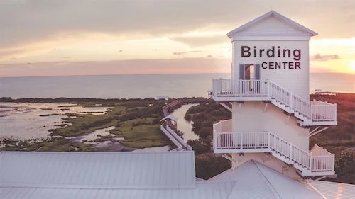 A white birding center along the coast of South padre Island during sunset.