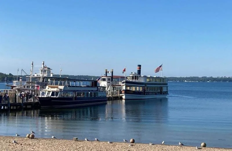 Boats sit quietly on the shore of Lake Geneva.