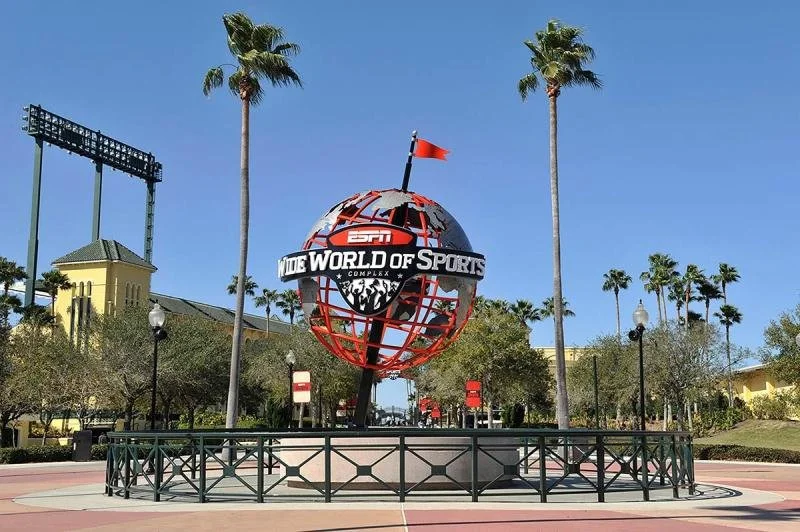 A red globe with a red flag at the entrance of the ESPN ballpark.