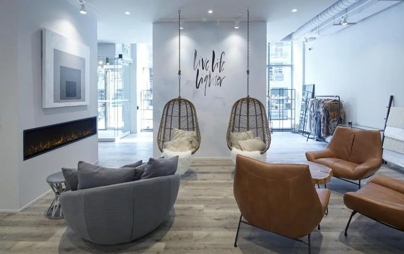 White walls, swinging chairs and fire in Hoame Meditation's reception area.