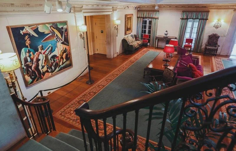 A large bright portrait inside the Reynolda House Museum of American Art.