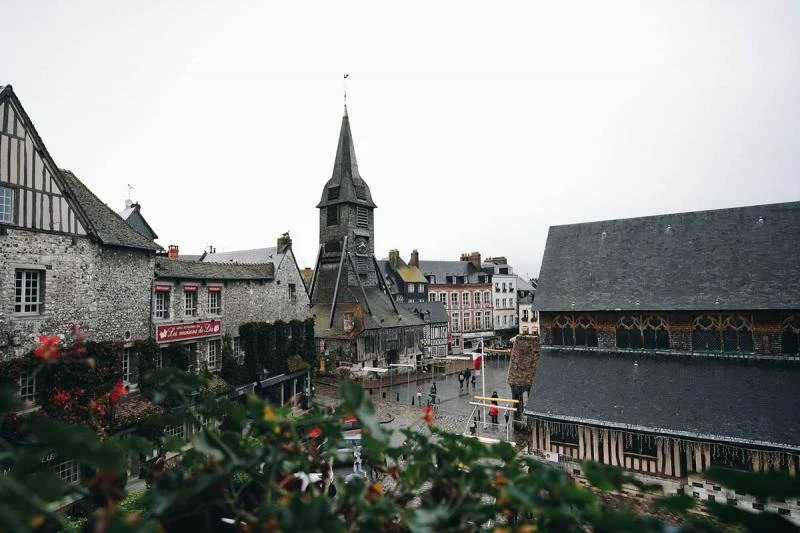The church of St. Catherine towers into the sky in honfleur.