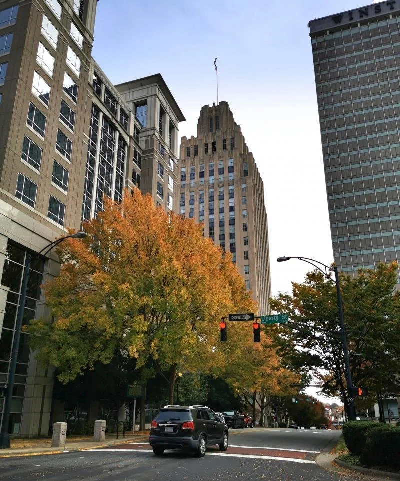 The 21-floor Art Deco skyscraper in downtown Winston-Salem towers over the street.