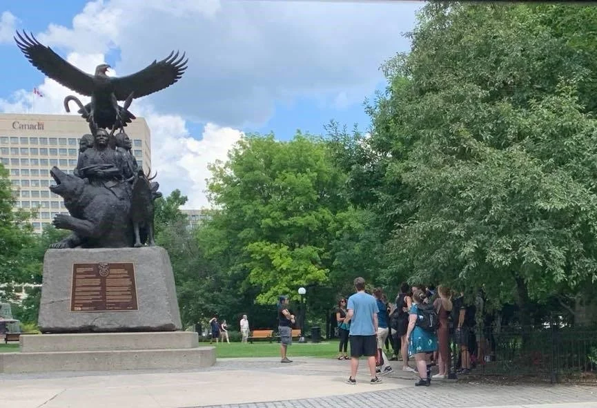 A group of visitors enjoy a tour of Indigenous Walks in Ottawa.