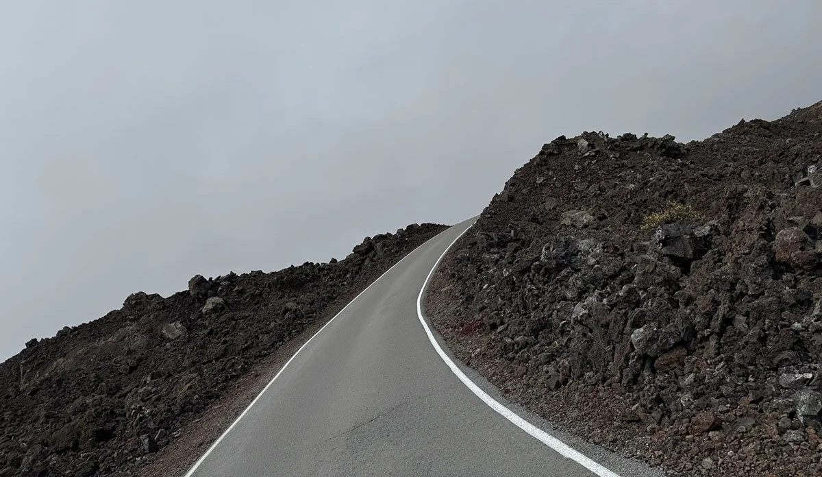 The desolate road up Mauna Loa, surrounded by hardened lava rock.