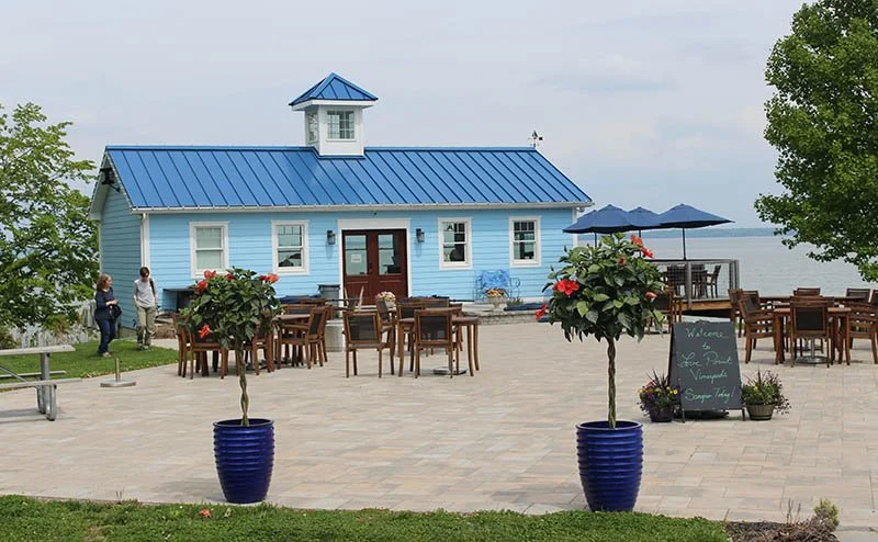 The bright blue roof and wood of the Love Point Vineyards and Winery.