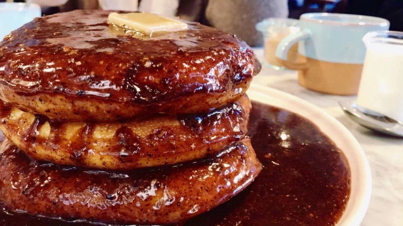 Thick pancakes in jam with butter on top from Cafe Gitane.