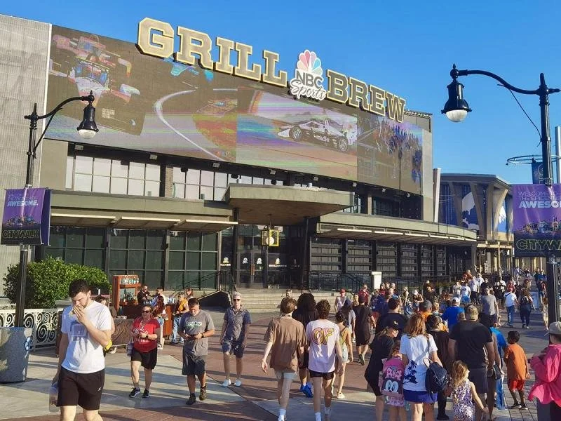 3 big screens at the front of NBC Sports Grill Brew.