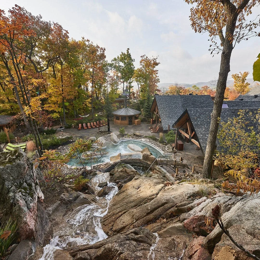 Steam rises from the Nordik Spa in Chelsea, Quebec during fall.