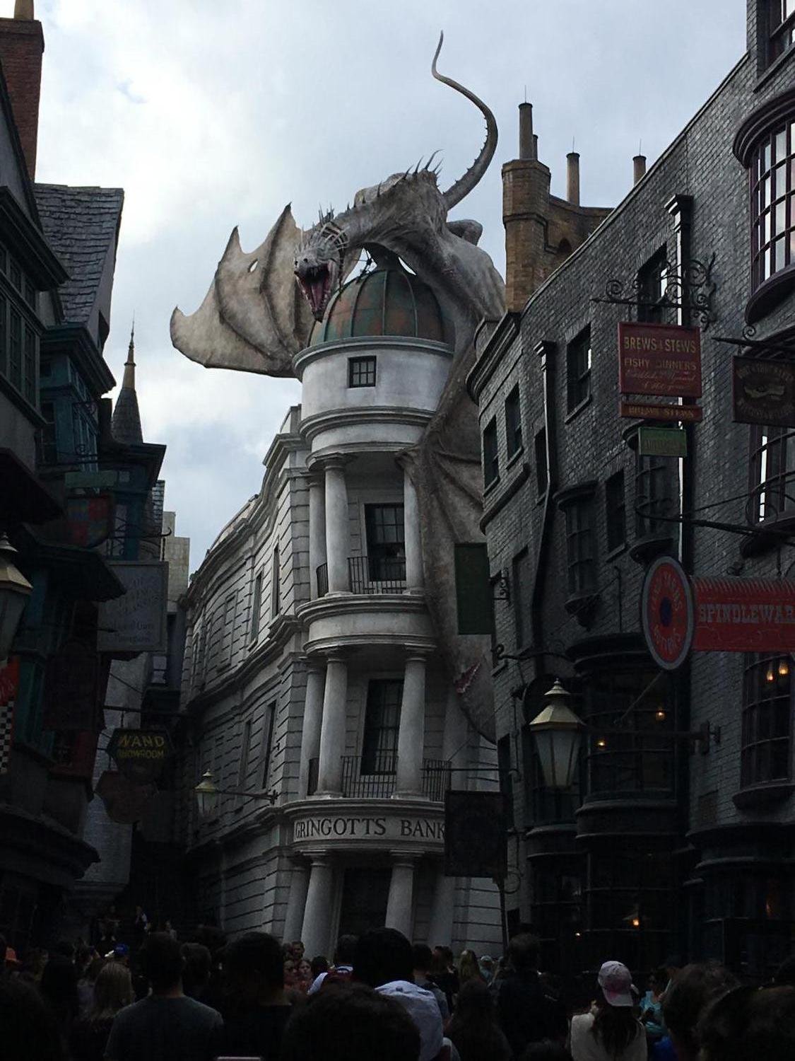 A dragon stands on top of Gringotts bank at Universal Studios