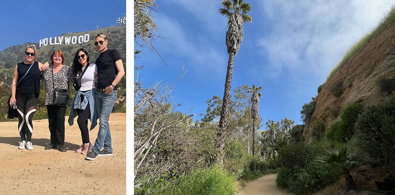 A group stands in front of the Hollywood sign while on tour with Bikes and Hikes Tours.