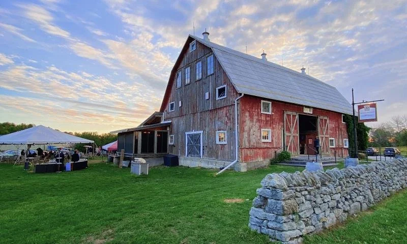 A sunset over a red barn at Karlo Estate Winery in Prince Edward County.