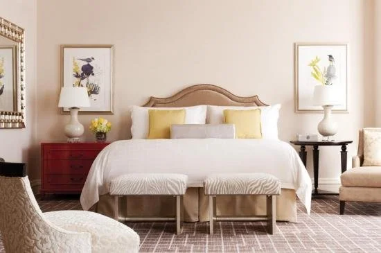 A bright white and yellow hotel room in Houston.