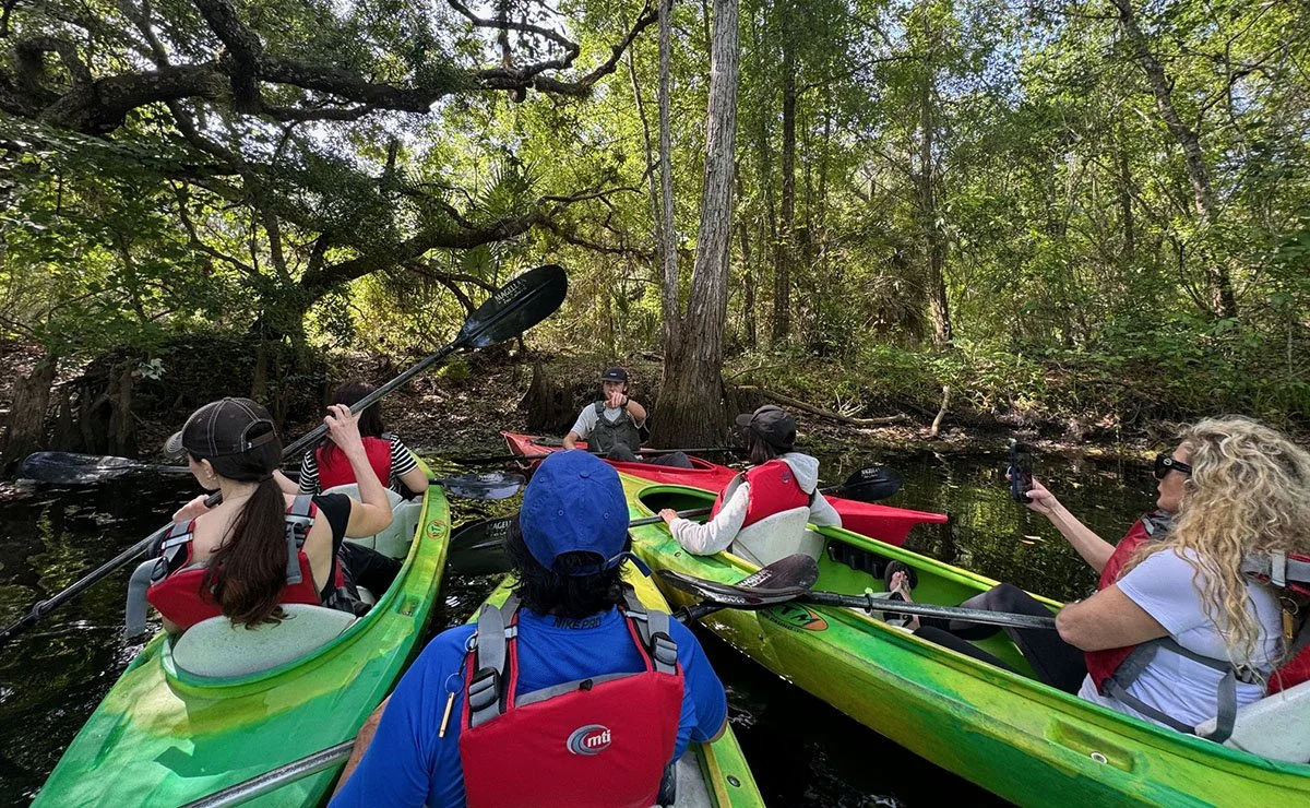 A group of tourists paddle at Shingle Creek in Kissimmee, Florida.