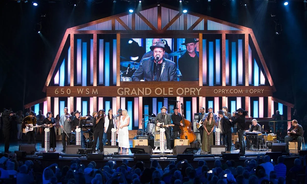 A large band takes the stage at the Grand Ole Opry in Nashville.