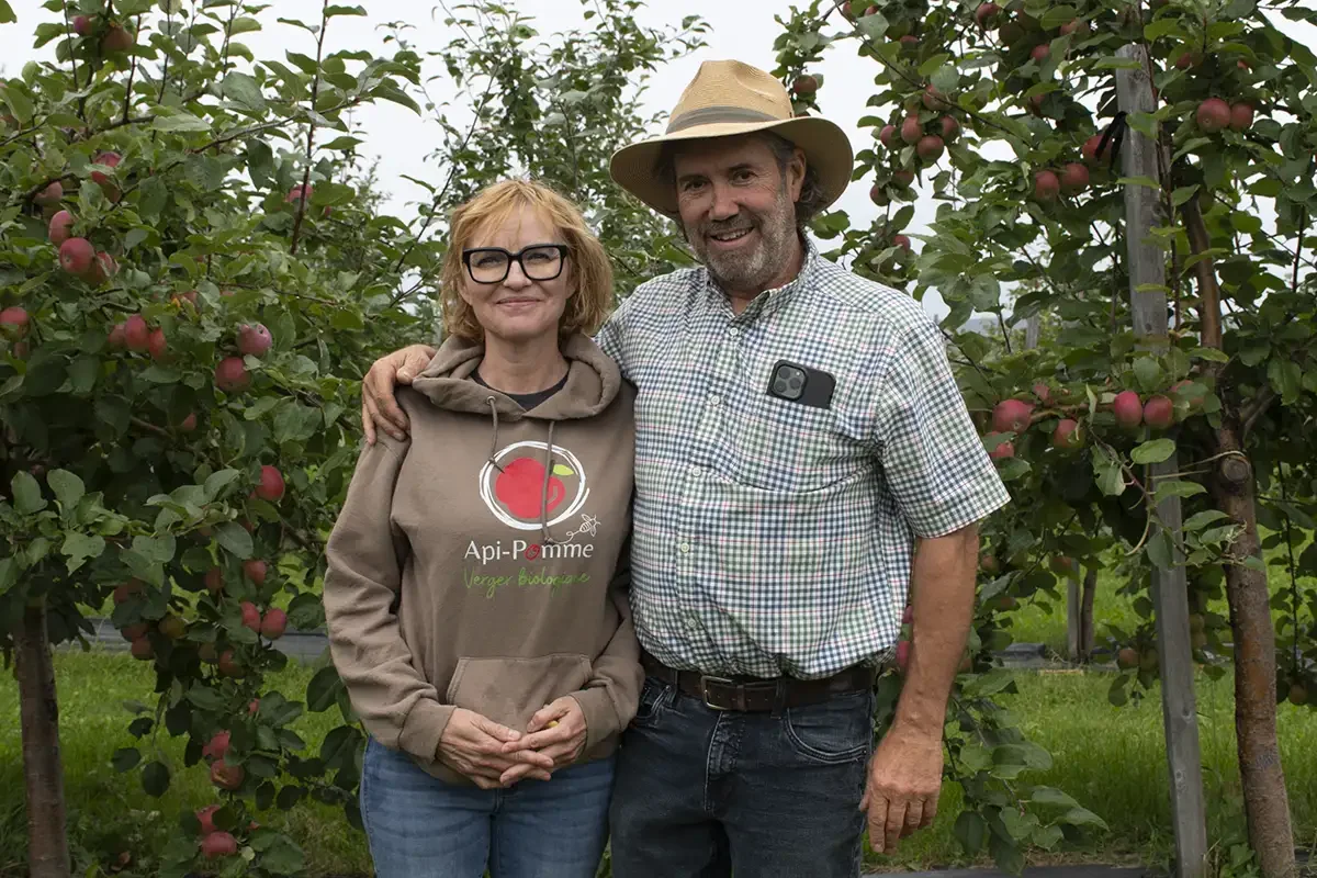 Api-Pomme owners Richard Gaudreault and Renee Chamberland in their orchard
