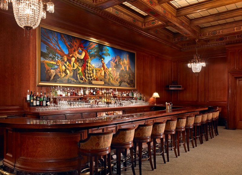 A renaissance painting hangs above a group of bottles at the Pied Piper Bar at the Palace Hotel.
