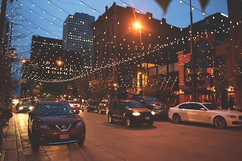 Lights shine on Denver's Larimer St. After dark.