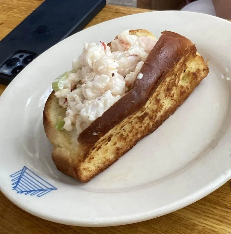 A blackened tuna sandwich from Pier 290 on a white plate.