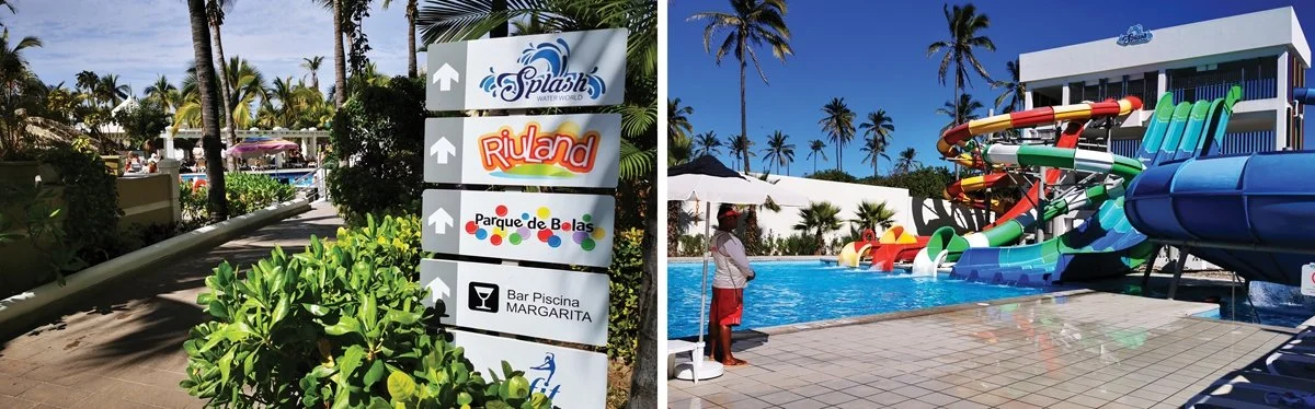 A lifeguard watches as waterslides pour into the pool.