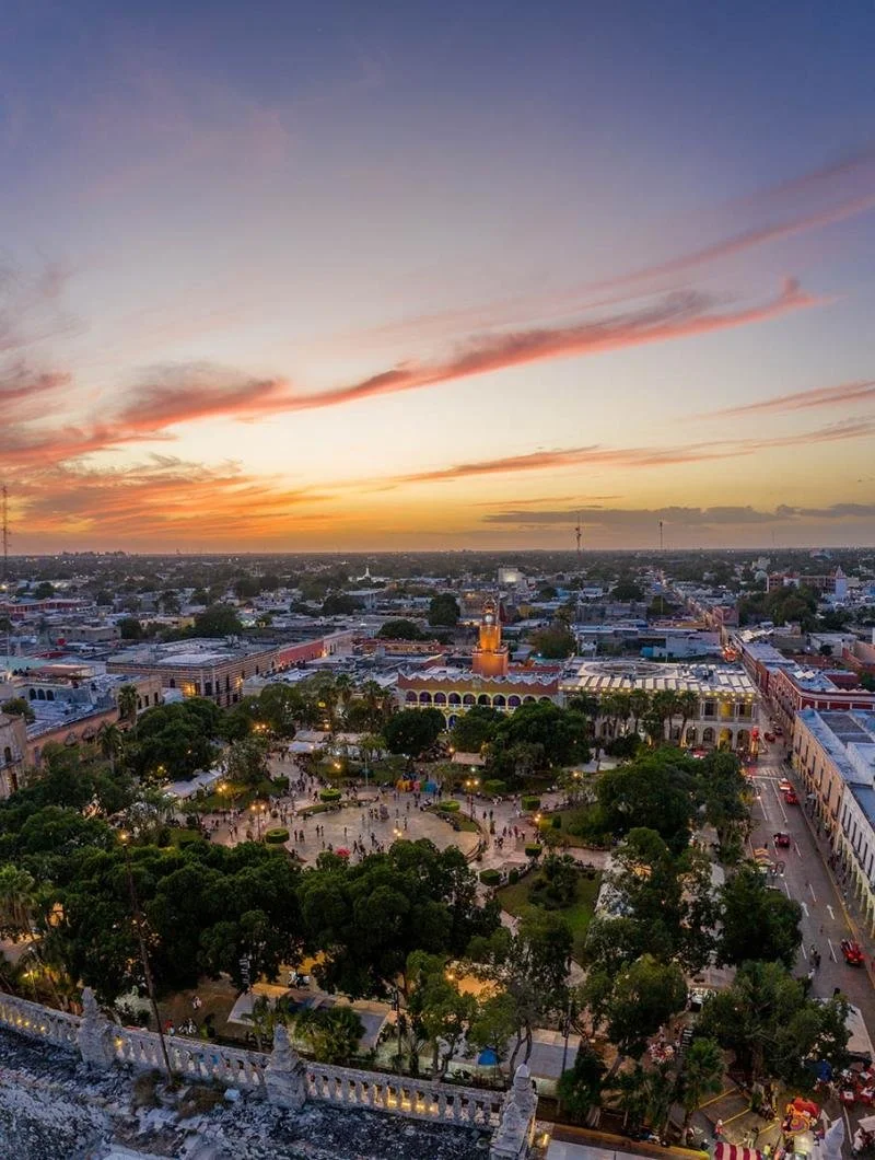 A purple yellow sunset hangs over the city center of Merida, the capital of Yucatan.