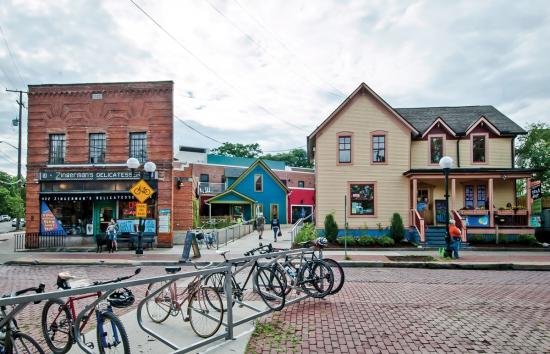 A line of bikes stand outside the quaint, brick building of Zingerman's Deli.