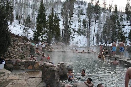 Tourists escape the winter cold and rest in Steamboat Springs.