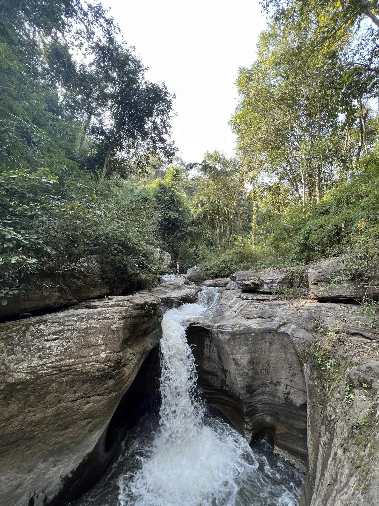 Tat Krok Waterfall cascades into a natural pool in Chiang Mai, Thailand.
