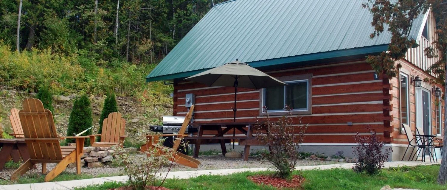 Wooden chairs and a cabin from the Bayside Resort.