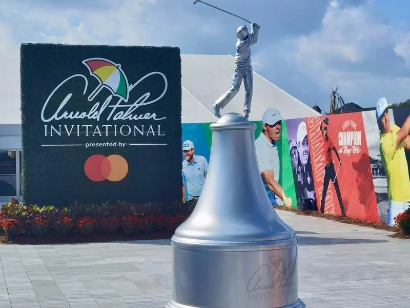 Signs and a statue at the Arnold Falmer Invitational.