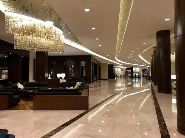 Lights reflect in a hotel lobby in Houston.