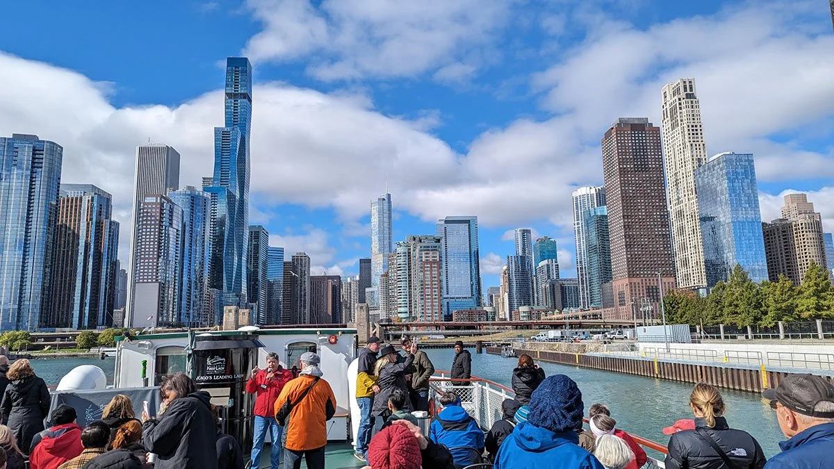 A view of the Chicago skyline from a boat along the river.