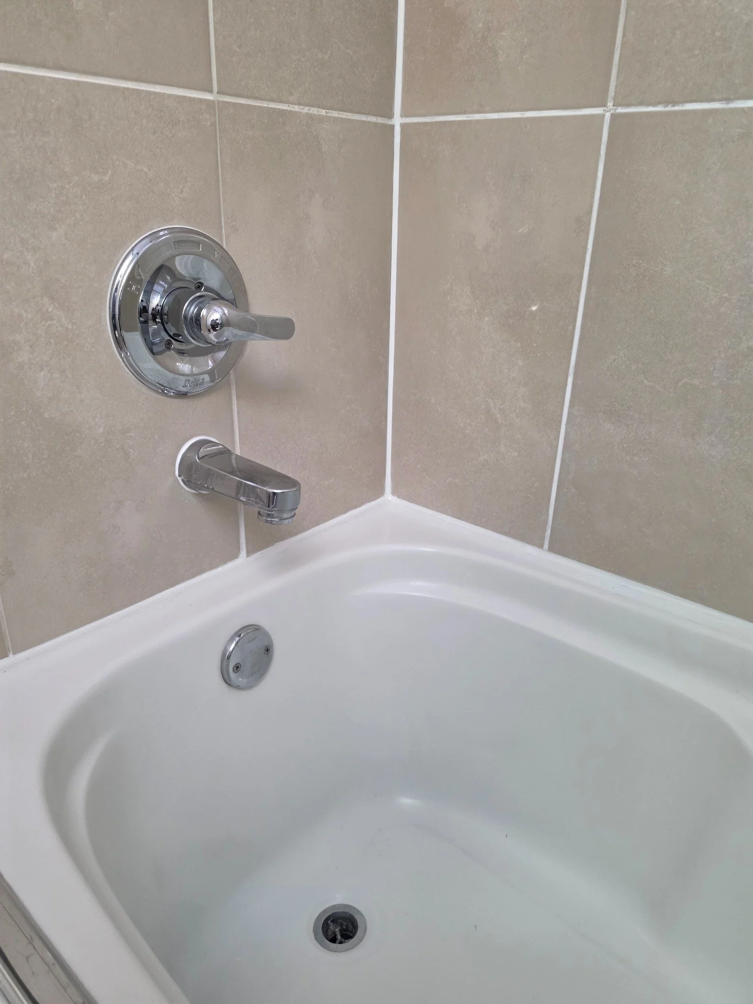 After — Clean, professionally re-caulked bathtub in Surrey, BC