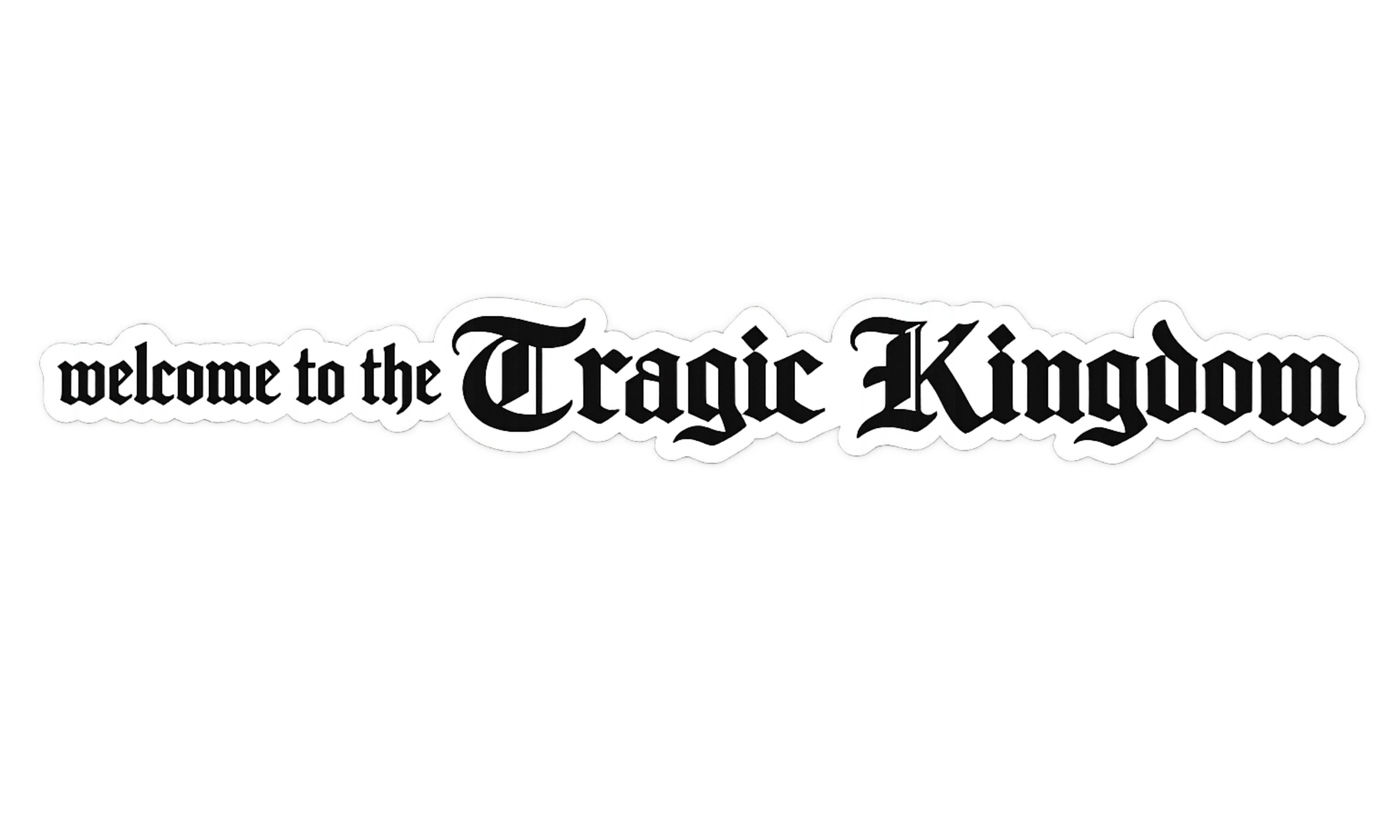 Black and white sign with Gothic font saying "welcome to the Tragic Kingdom".