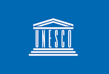 UNESCO logo with a blue background and white outline of a classical building with columns.