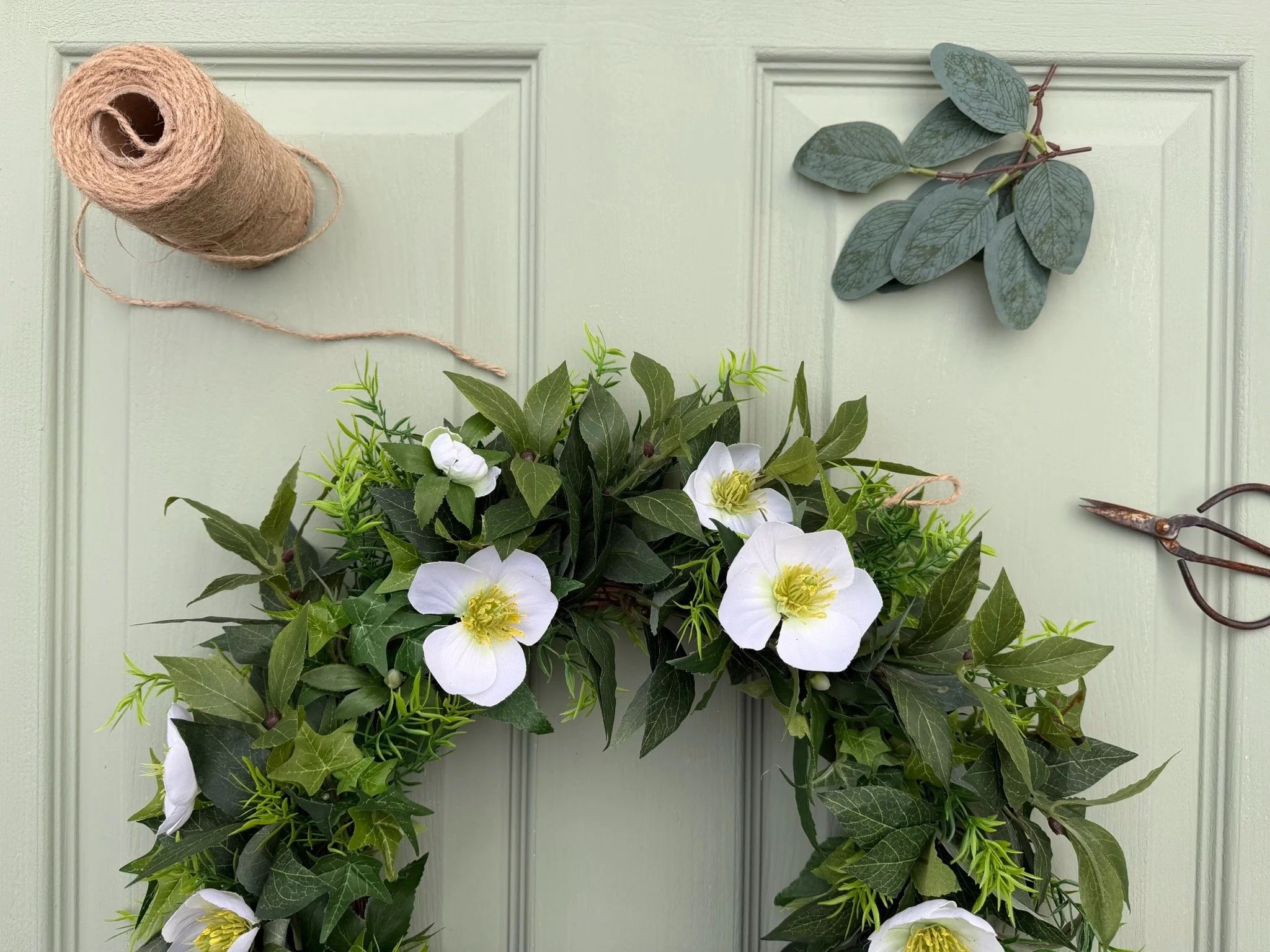 The Ancient History Behind Your Front Door Wreath