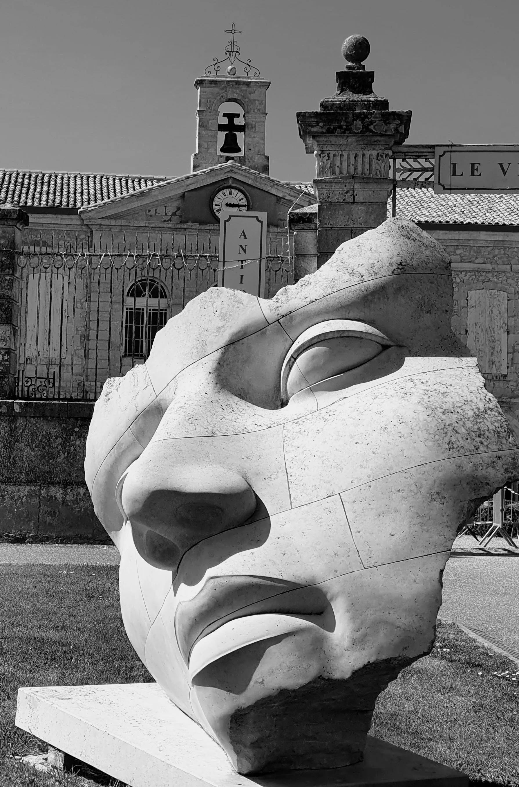 A large modern sculpture of a face located outside the village of antiques in the chic town of Lectoure in the Gers southwest France.