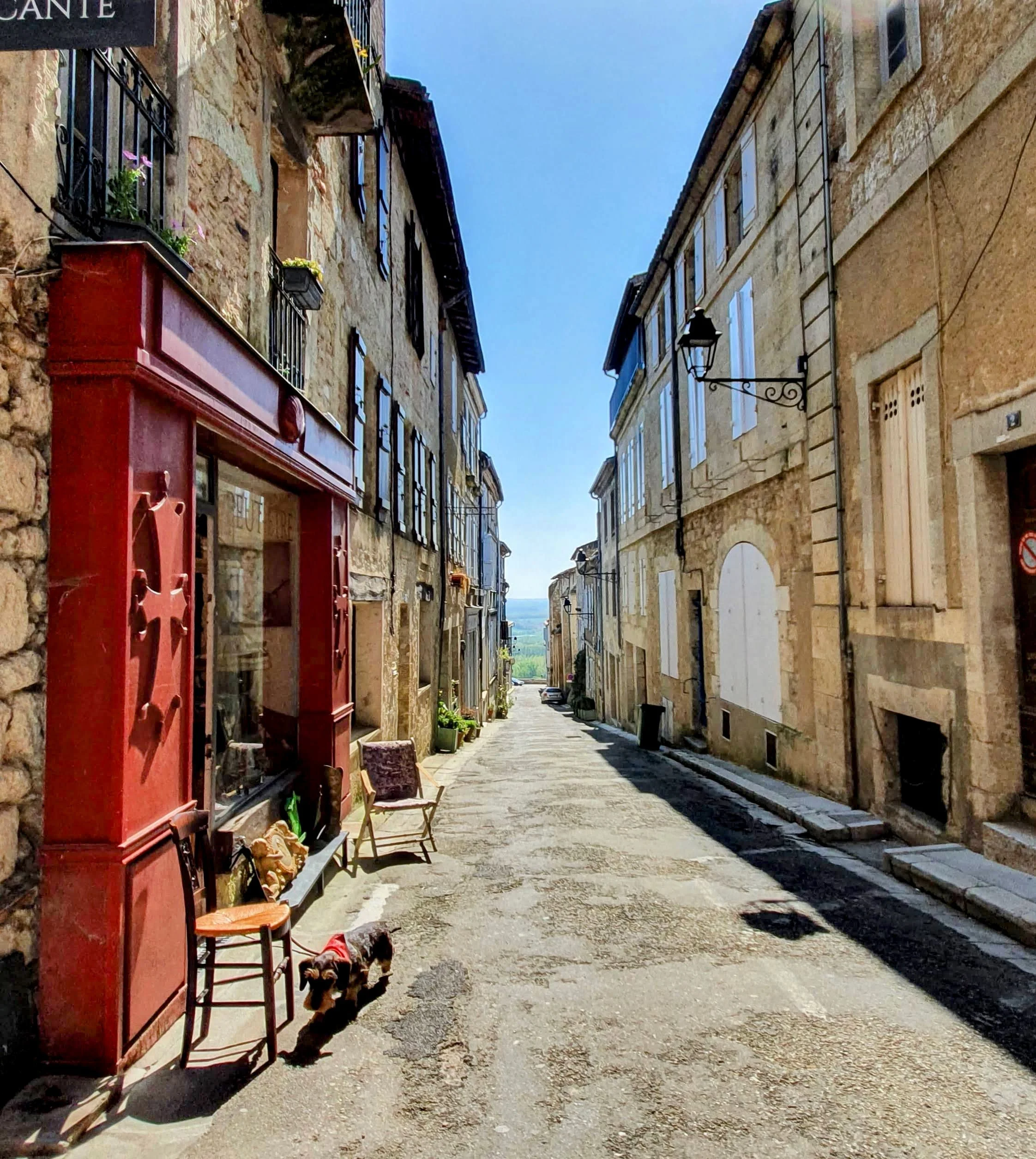A narrow street featuring a brocante in one of Gascony's most chic towns, Lectoure.