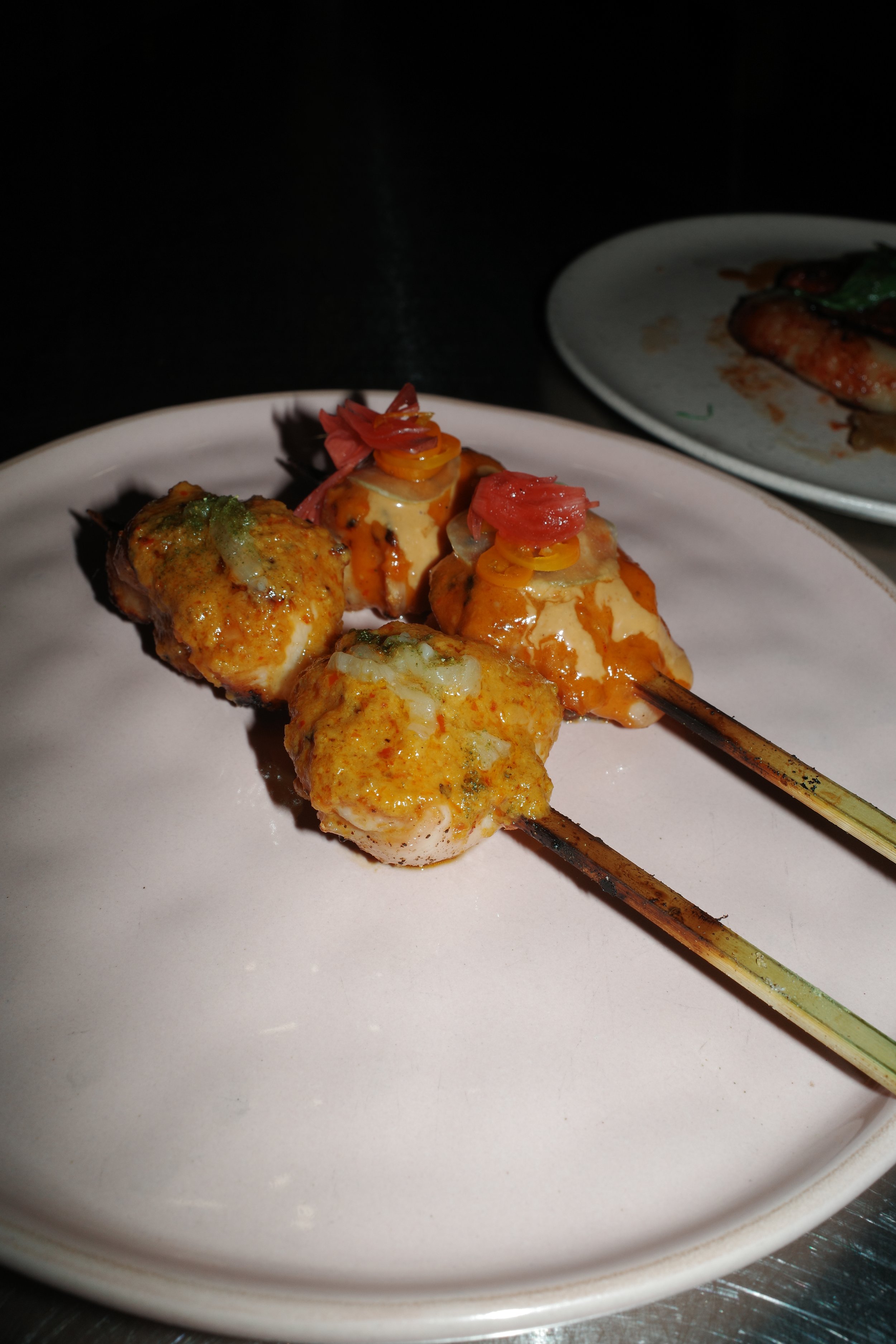 Social Media content to promote a new brunch offer at a restaurant in Zurich. It shows a table set for a meal with various dishes, drinks, and flowers, including sliders, banana chips, salad, lemon slices, and a variety of beverages.