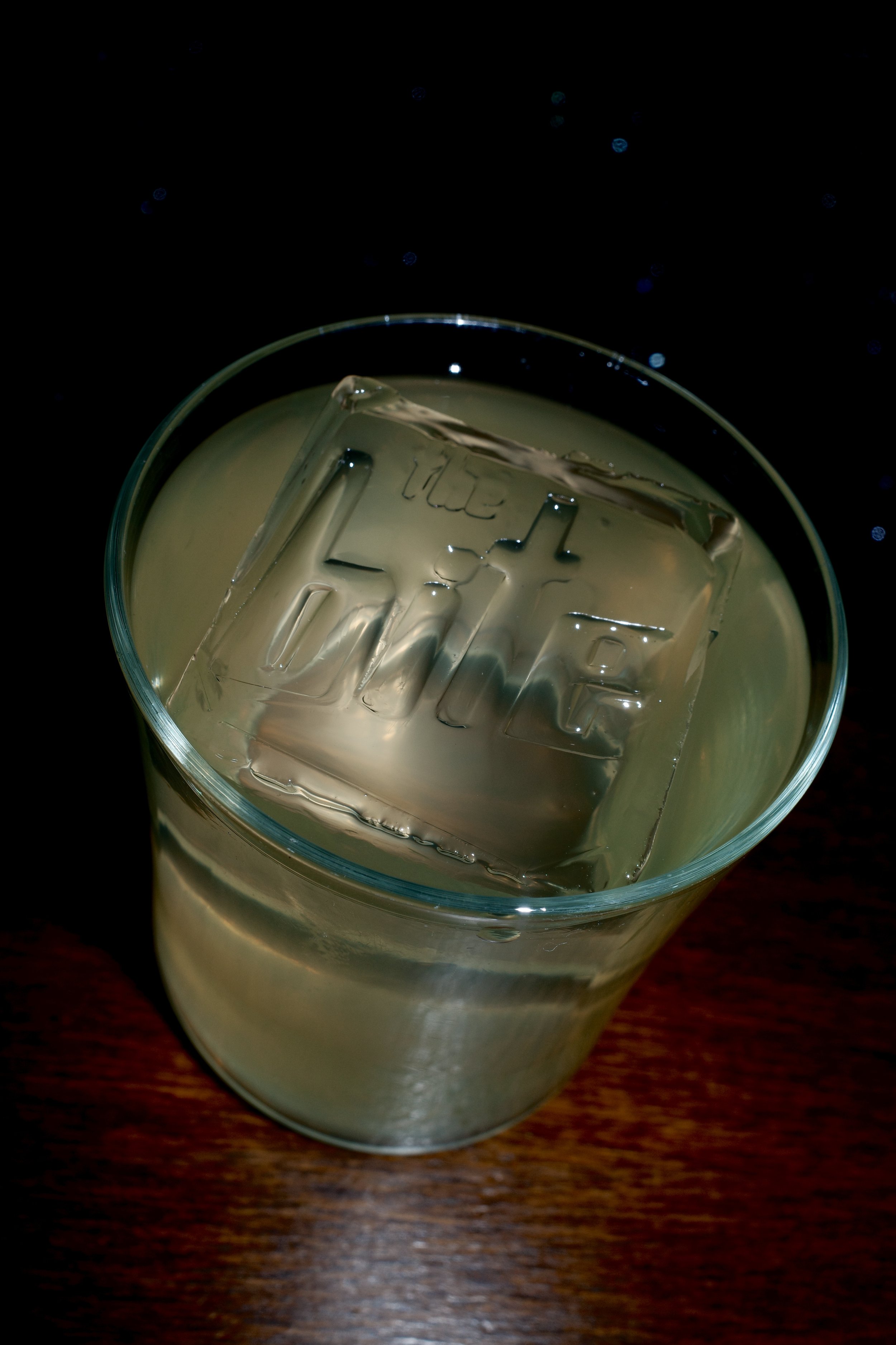 Social Media content, it includes a hand holding a glass of rosé wine