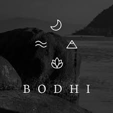 A black and white photo of a large rock on the beach at sunset, with a crescent moon in the sky and the word 'BODHI' written below.